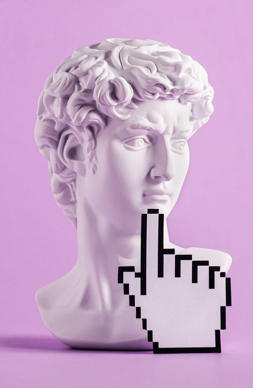 Historical antique statue of david's head and mouse cursor with finger